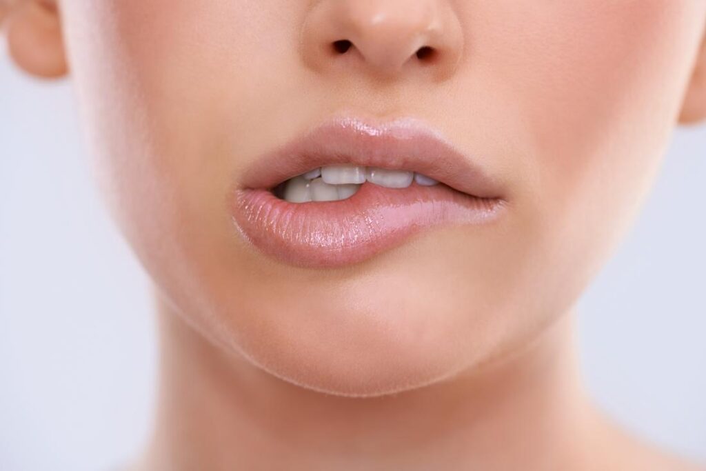 Lip Biting Meaning Causes Symptoms Images Bumps Swollen Lip From Biting And Treatment