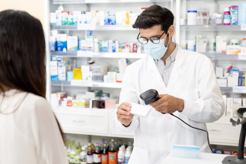 pharmacist scanning a medicine's barcode