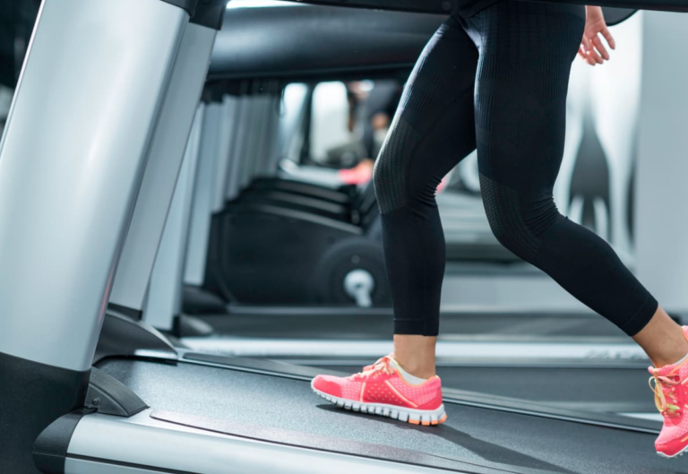 Woman on a treadmill. Benefits of treadmill workout