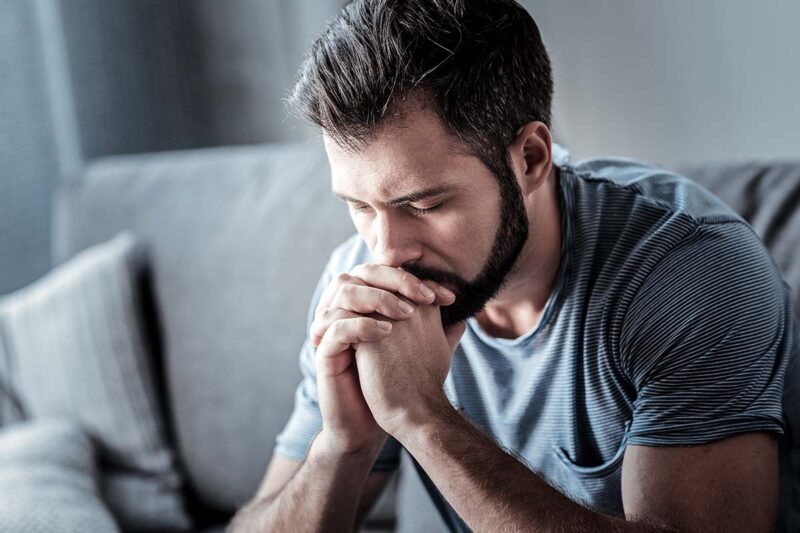 Depressed Man sitting down. Concept for Cocaine Addiction