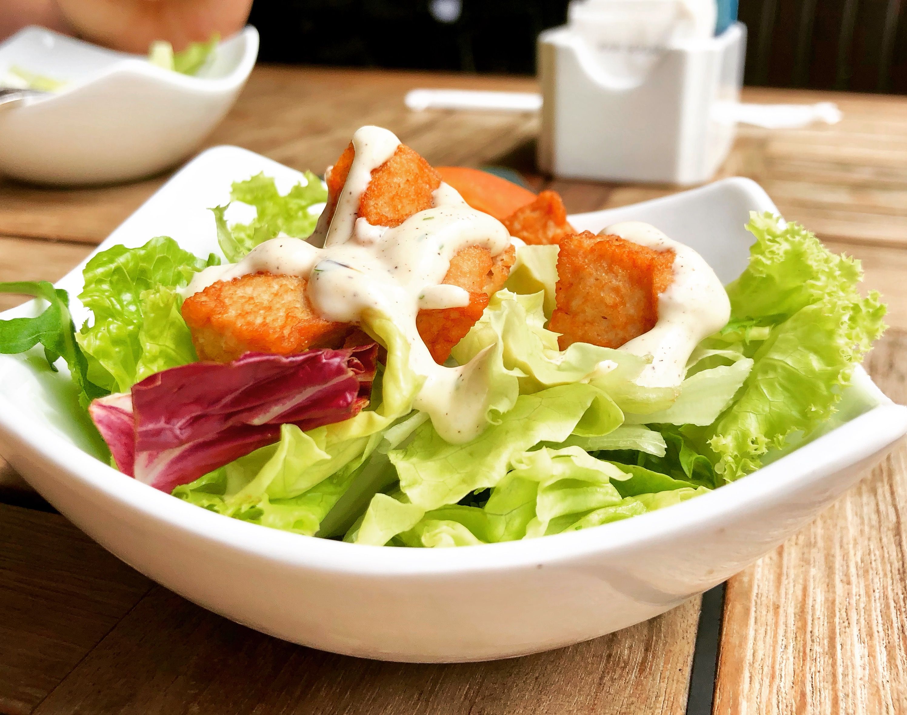 Fresh salad with crispy tofu and creamy dressing for a gluten-free meal