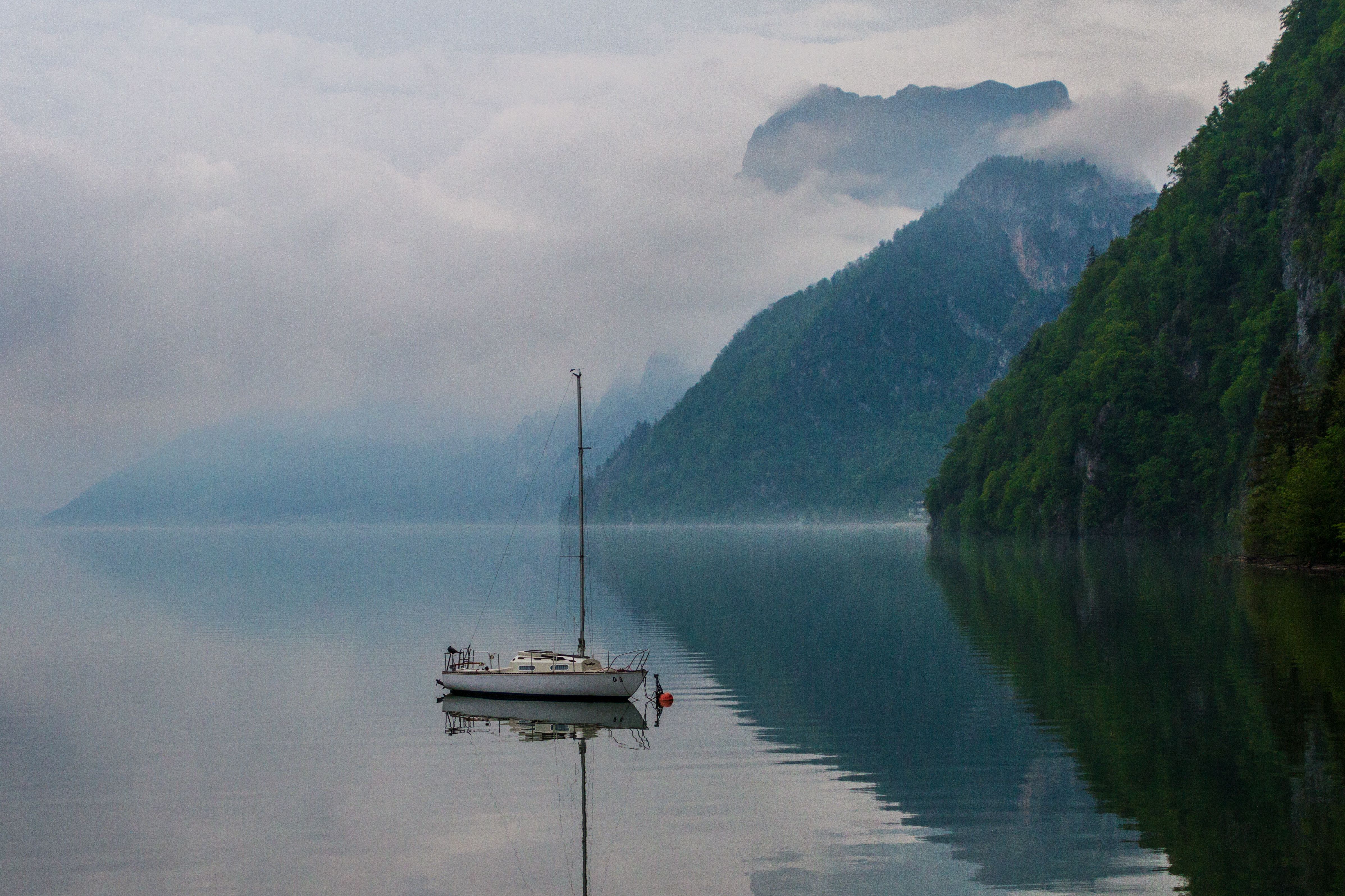 Misty alpine lake and mountains creating a secluded, peaceful backdrop in Bavaria.